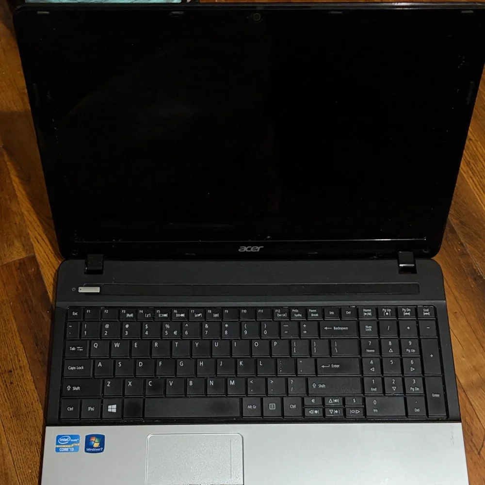 Acer Black Laptop with Silver Logo